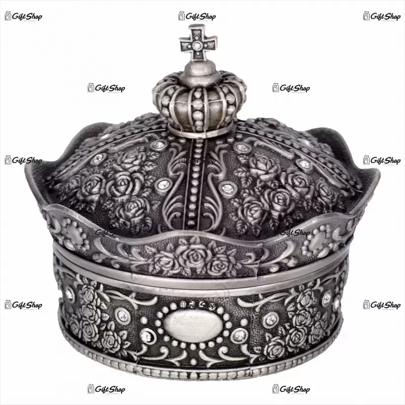 Caseta bijuterii din metal in forma de coroana cu capac si ornament de cruce pe varf.